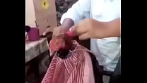 rooster having hair cut